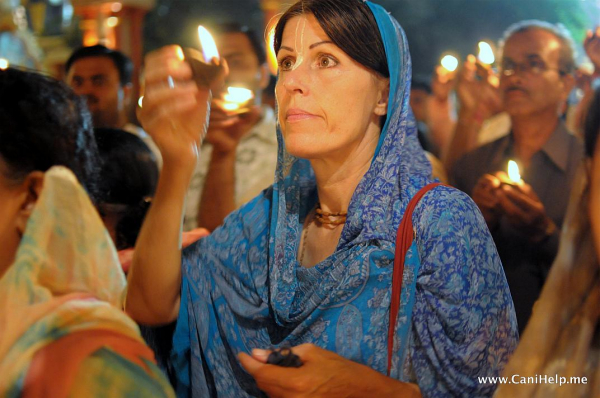 A devotee offers a lamp to the Lord with love and devotion